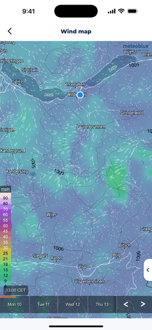 Sonuby's wind map showing wind patterns and speeds around Interlaken, Switzerland with color-coded wind velocities ranging from 6 to 90 mph, displaying small white arrows indicating wind direction and a blue location marker